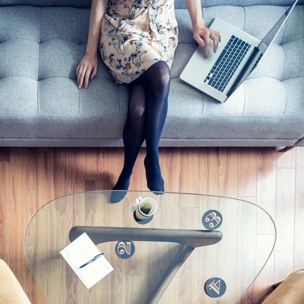 Blonde Woman Using Her Laptop at Home